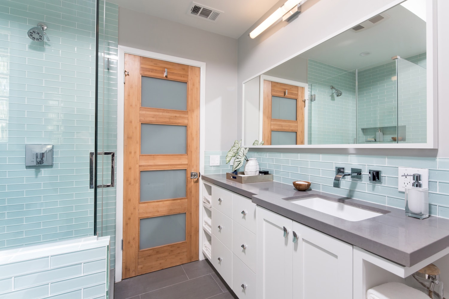 Modern bathroom with turquoise tile shower