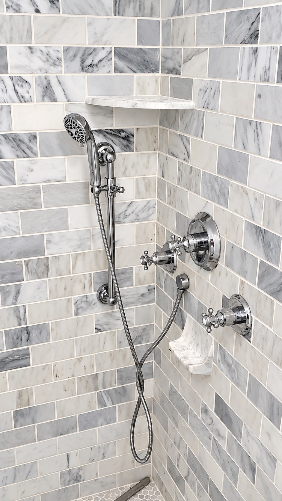 Marble subway tile shower fixtures