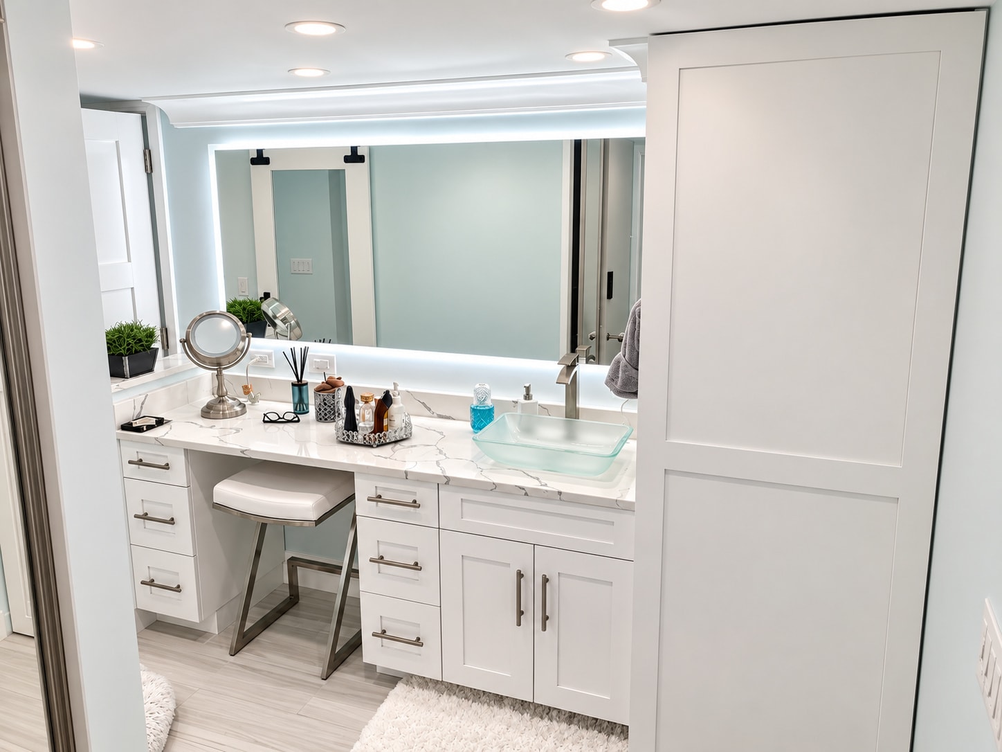 Modern bathroom vanity with lighted mirror