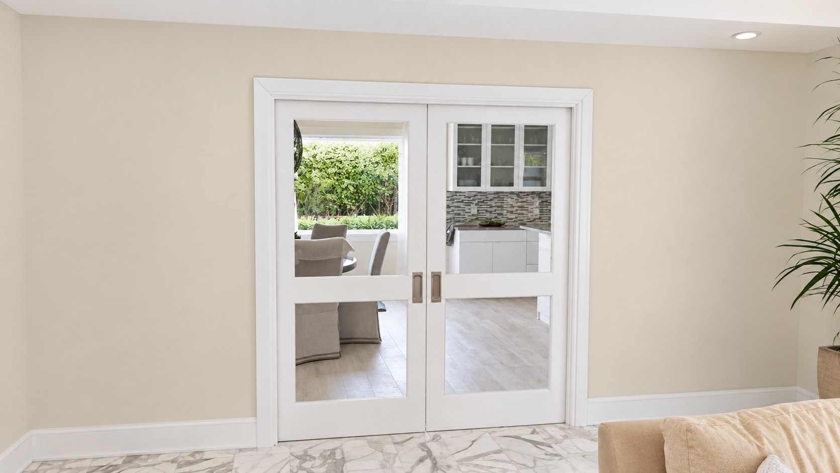 White French doors opening to outdoor patio